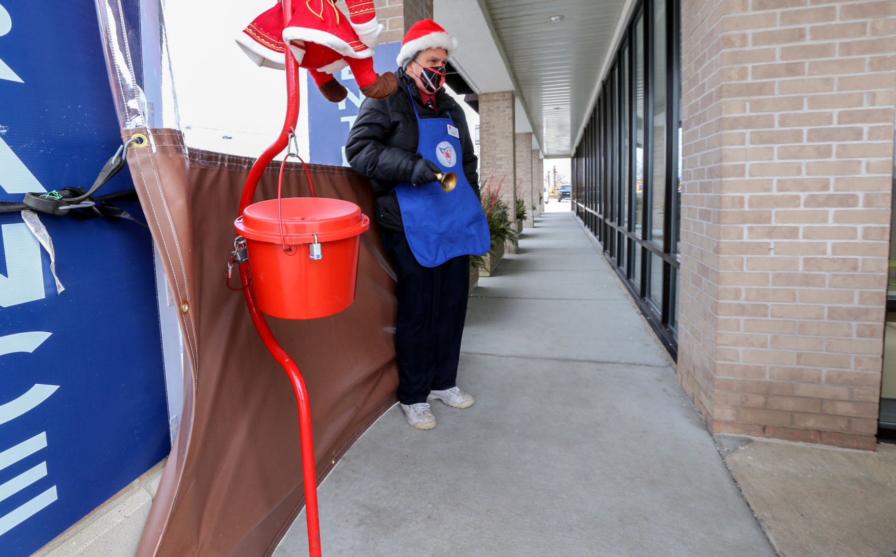 Kevin Feldman, Director of Development for The Salvation Army ringing bell